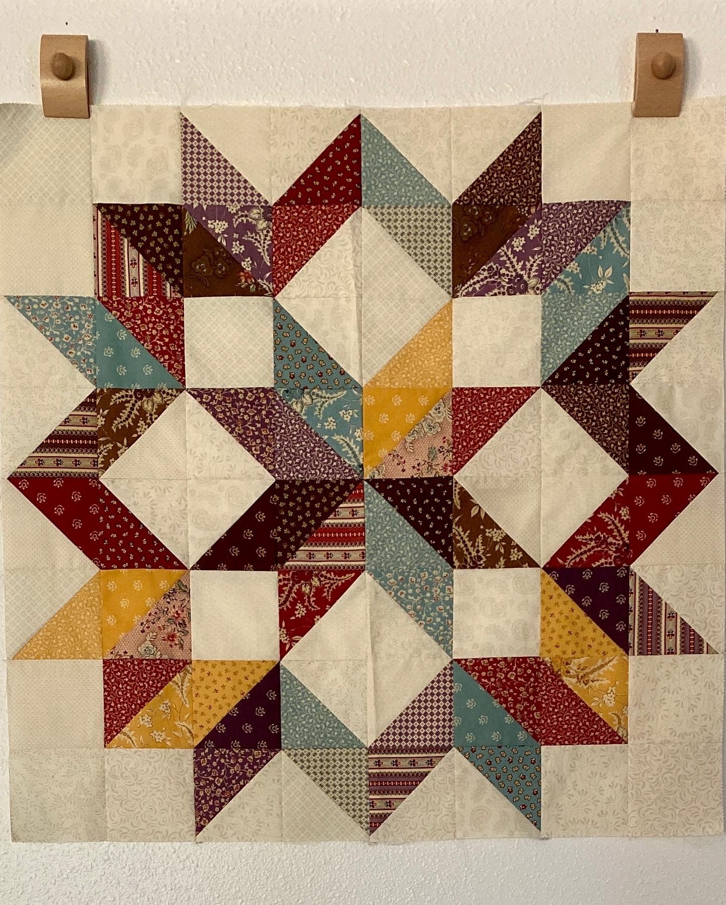 Carpenter's Wheel Quilt reproduction fabrics fall colors brown gold maroon lavender light blue cream by Essentially Loved Quilts star